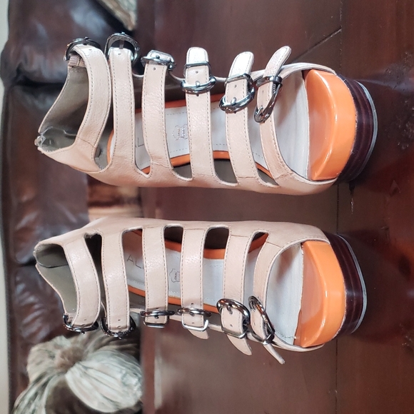 Platform tan booties with 6 buckle straps & a fun pop of orange under toes! - Picture 2 of 7